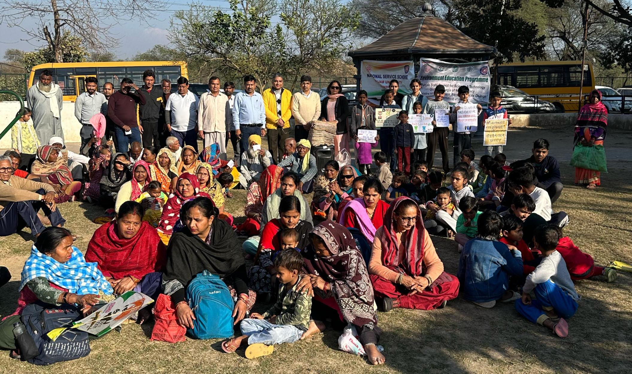 Panjab University NSS Distributes Shawls and Promotes Education at Village Dhanas